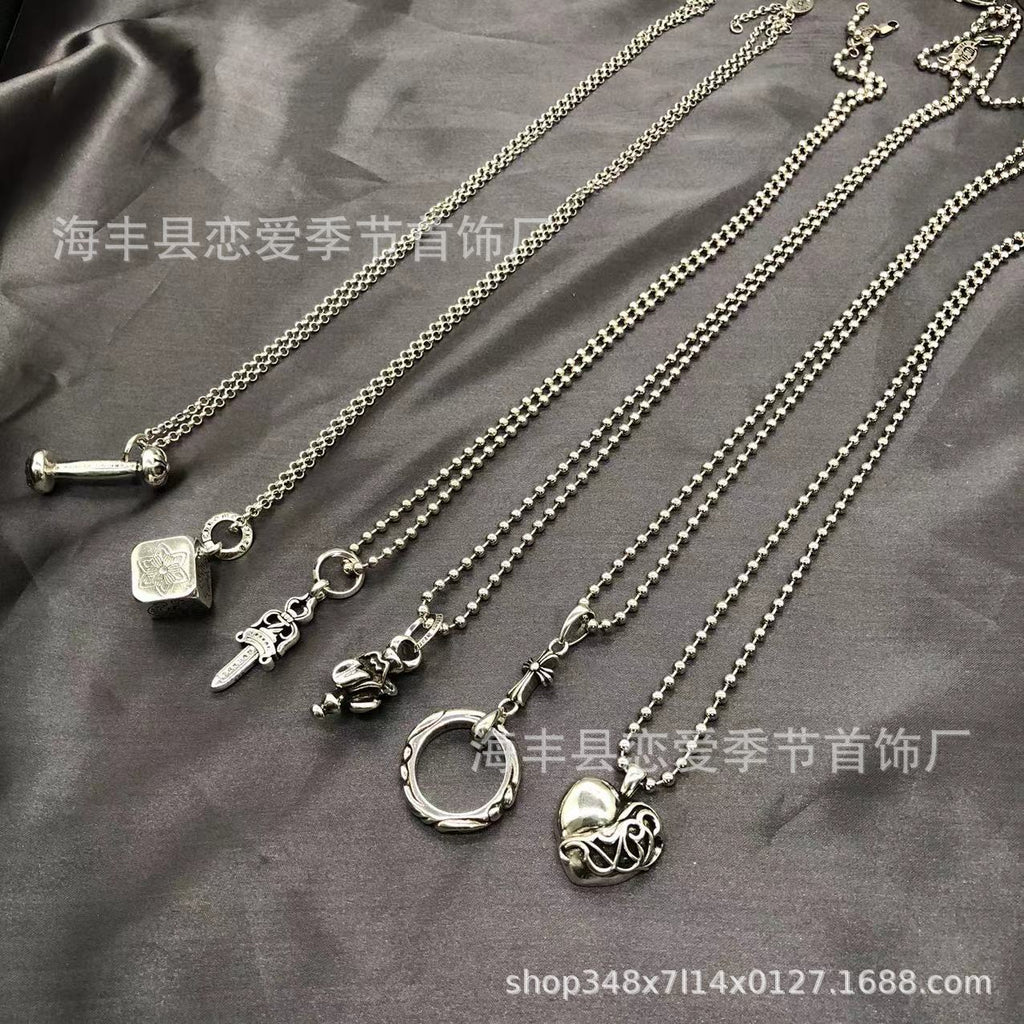 Chrome Hearts heart-shaped sword cross pendant